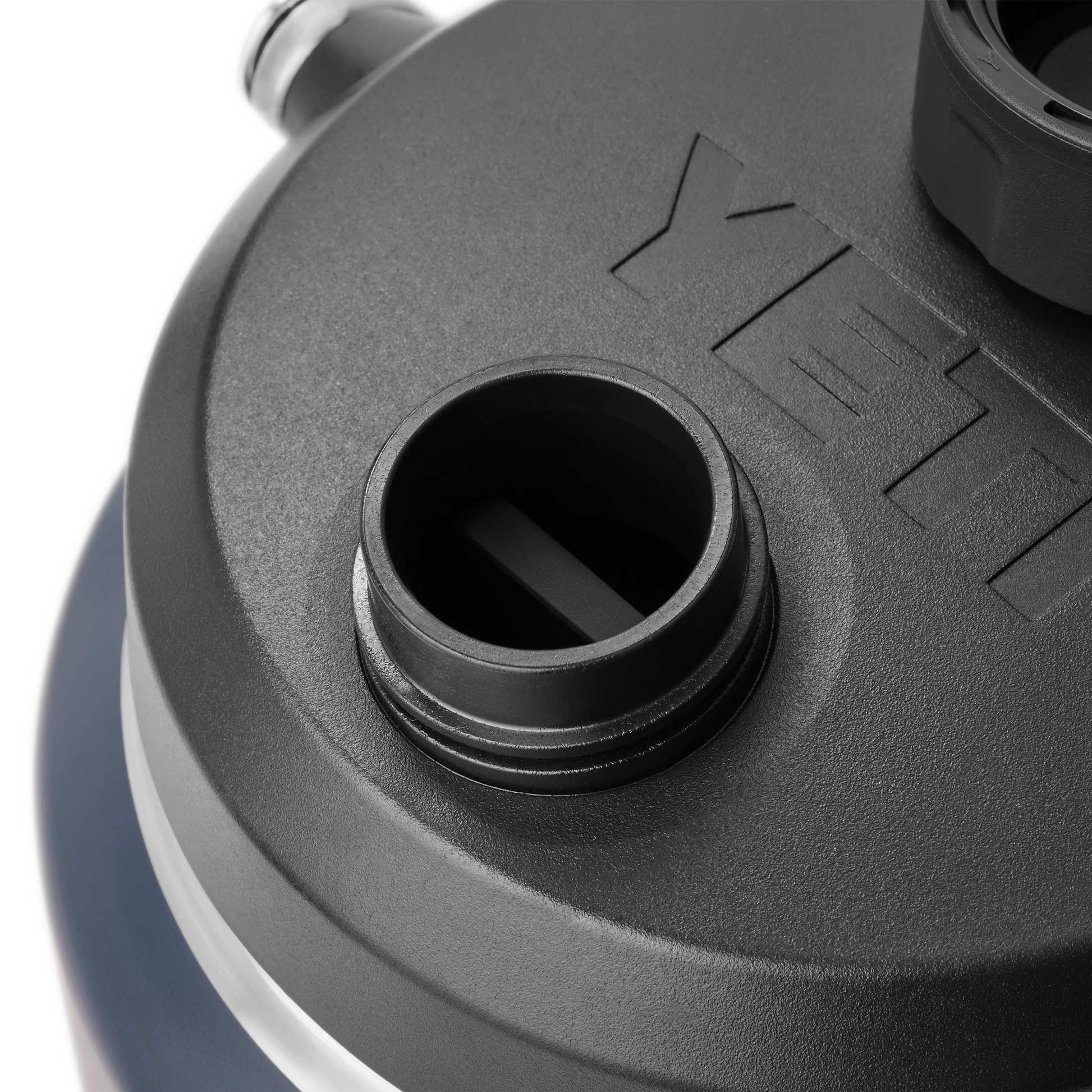 Close-up of a YETI brand lid on a white background
